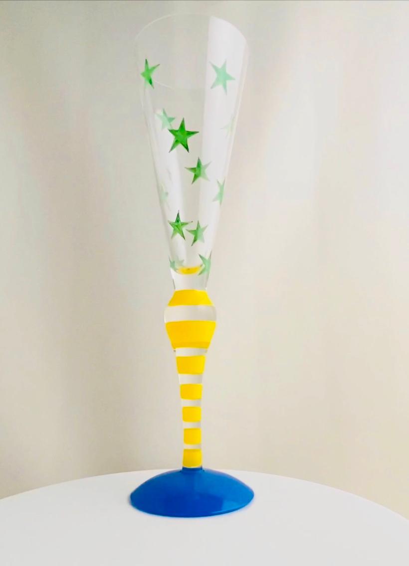 A set of eight Orrefors Clown glass champagne flutes design Anne Nilsson